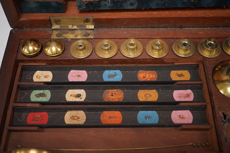 A mid 19th century folding compound and simple monocular microscope by William Harris & Co. 50 High Holborn, London, in its fitted mahogany case with paper maker’s label to inside of the lid. Condition - fair to good, so